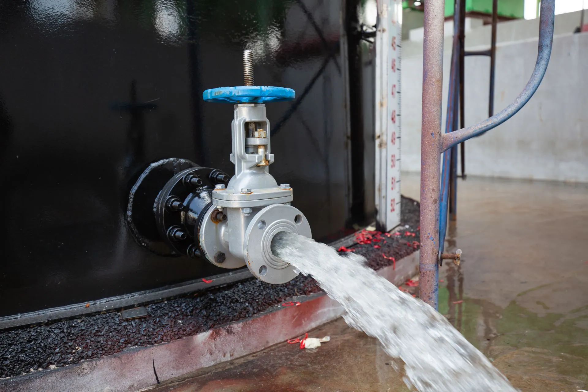 Technician evaluating water pressure and valve condition